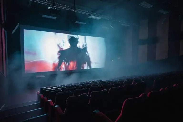 Top horror movies of 2026 shown on a glowing cinema screen in a dark theater